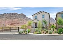 Charming home featuring a desert landscaped front yard, complemented by mountain views at 1388 Graphite Ave, Henderson, NV 89002