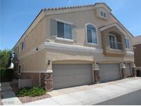 Charming stucco home with three-car garage and manicured landscaping in a residential neighborhood at 3208 Regal Swan Pl # 3, North Las Vegas, NV 89084