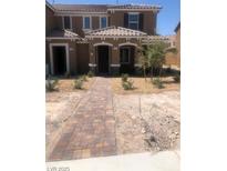 Charming two-story home featuring a landscaped front yard and inviting entrance at 3270 Trabia Ave, Henderson, NV 89044