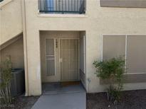 Inviting front entrance to this unit featuring a screen door, secure access, and easy access to the community at 5710 E Tropicana Ave # 1053, Las Vegas, NV 89122