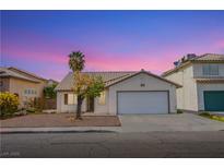 Charming single-story home featuring desert landscaping and an attached two car garage at 6274 Elderberry Wine Ave, Las Vegas, NV 89142