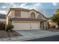 Charming two-story home with a well-manicured lawn and a spacious three-car garage at 787 Craigmark Ct, Henderson, NV 89002