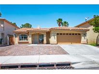 Charming single-story home with a well-manicured front yard and a two-car garage at 8504 W Gilmore Ave, Las Vegas, NV 89129