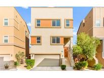 Modern two-story home with a two-car garage and desert landscaping at 10525 Shiny Skies Dr, Las Vegas, NV 89129