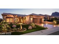 Attractive single-story home featuring manicured desert landscaping and a tile roof at 10713 Shoalhaven Dr, Las Vegas, NV 89134