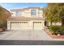 Charming two-story home featuring a three-car garage and desert landscaping at 5832 Ivy Vine Ct, Las Vegas, NV 89141