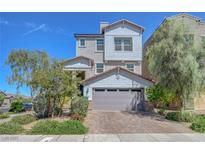 Charming two-story home with a two car garage, manicured landscaping, and inviting curb appeal at 96 Campbelltown Ave, Henderson, NV 89015