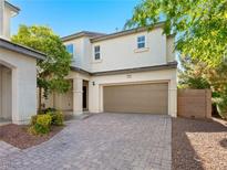 Inviting two-story home boasts a pristine exterior, lush landscaping, and a spacious two-car garage at 1030 Maple Pines Ave, North Las Vegas, NV 89081