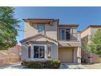 Charming two-story home featuring a balcony, bay window, and a well-maintained front yard at 10456 Processor Ct, Las Vegas, NV 89129