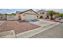 Charming single-story home with low-maintenance landscaping and attached two-car garage at 1117 Azure Heights Pl, Las Vegas, NV 89110