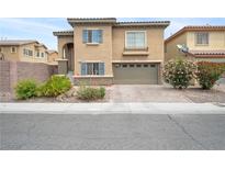 Charming two-story home with a well-maintained front yard and a two car garage at 2208 Dale Bumpers Ct, North Las Vegas, NV 89081