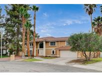 Stunning two-story home features a tile roof and manicured landscaping creating great curb appeal at 2224 Lucerne Ct, Henderson, NV 89014