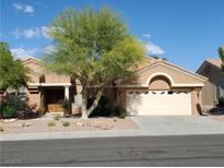 Charming single-story home featuring a well-maintained landscape and inviting curb appeal with a two car garage at 2540 Faiss Dr, Las Vegas, NV 89134