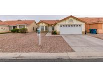 Charming single-story home with a well-maintained lawn, desert landscaping, and a two-car garage at 2595 Fort Lauderdale Dr, Las Vegas, NV 89156