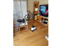 Cozy living room with natural light, wood floors, and entertainment setup at 3425 E Russell Rd # 161, Las Vegas, NV 89120