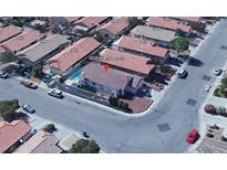 This aerial view showcases a well-maintained home with a private pool and easy access to the neighborhood streets at 3808 Lilac Haze St, Las Vegas, NV 89147