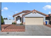 Charming single-story home with well-maintained landscaping and a two-car garage at 3808 Lilac Haze St, Las Vegas, NV 89147