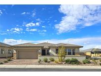Charming single story home with a two car garage, desert landscaping, and a welcoming front entryway at 701 Monroe Hill Pl, Henderson, NV 89011