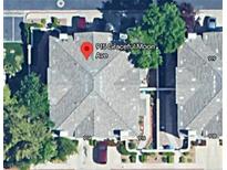 An aerial view shows the layout of attached homes, each with its own driveway and manicured landscaping at 915 Graceful Moon Ave, Henderson, NV 89015