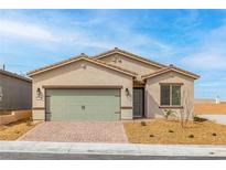Charming single-story home featuring a two-car garage and low-maintenance desert landscaping in front at 2739 Avril Point St, Las Vegas, NV 89156