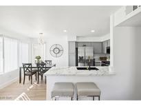 Bright kitchen and dining area with stainless steel appliances and marble countertops at 3425 E Russell Rd # 202, Las Vegas, NV 89120