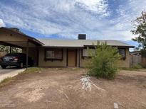 Charming single-story home with a covered parking area and a low-maintenance yard at 3933 Lighthouse Ave, Las Vegas, NV 89110