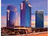 View of The Palms luxury resort with its modern architecture against a vibrant sunset at 4381 W Flamingo Rd # 27309, Las Vegas, NV 89103