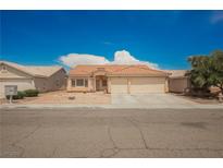 Charming single-story home with a tile roof and well-maintained landscaping at 4412 Red Blanket Rd, North Las Vegas, NV 89032