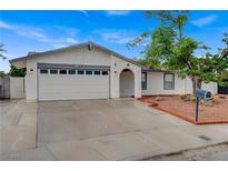 Charming single-story home featuring a two-car garage and low-maintenance desert landscaping at 4430 Eureka Cir, Las Vegas, NV 89103