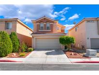 Inviting two-story home featuring a two-car garage and manicured landscaping at 4515 Sandstone Vista Ct, North Las Vegas, NV 89031