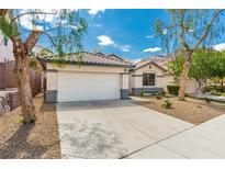 Charming single-story home featuring a two-car garage, desert landscaping, and a well-maintained front yard at 71 Blaven Dr, Henderson, NV 89002