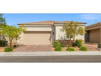Charming single-story home featuring a two-car garage and desert landscaping for low maintenance appeal at 8668 Marcana St, Las Vegas, NV 89166