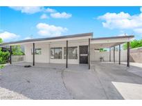 Charming single-story home with a covered entrance and ample parking at 1800 Atlantic St, Las Vegas, NV 89104