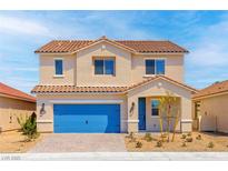 Charming two-story home with a blue garage door and a well-manicured front yard on a sunny day at 4405 Pioche Ave, North Las Vegas, NV 89032