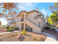 Charming condo features multiple levels and well-maintained landscaping in a serene setting at 5710 E Tropicana Ave # 2122, Las Vegas, NV 89122