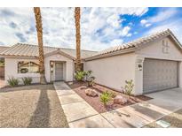 Charming single-story home features desert landscaping and a two-car garage at 7413 Red Eagle St, Las Vegas, NV 89131