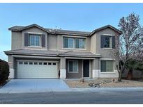 Charming two-story home featuring a two-car garage and well-maintained front yard at 1004 Windy Ferrell Ave, North Las Vegas, NV 89081