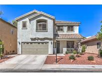 Charming two-story home with a well-maintained front yard and a two car garage at 11143 Castellane Dr, Las Vegas, NV 89141