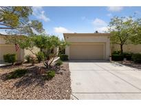 Charming single-story home with desert landscaping and a spacious two-car garage at 2208 Spring Water Dr, Las Vegas, NV 89134