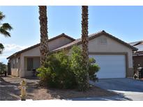 Charming single-story home featuring a two-car garage and desert landscaping at 2845 Kensington St, Las Vegas, NV 89156