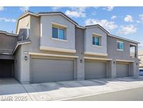 Charming townhome with well-maintained landscaping and attached garages at 4465 Shimmering Skies St # 1177, North Las Vegas, NV 89031