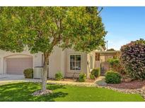 Charming home featuring a well-manicured lawn, mature tree, and lovely garden, perfect for curb appeal at 506 Chestnut View Pl, Henderson, NV 89052