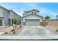 Charming two-story home featuring stone accents and a stylish paved driveway at 8909 Cherry Barn St, Las Vegas, NV 89113