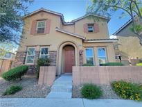Charming two-story home featuring a well-maintained front yard with stone accents, and an inviting entrance at 11083 Ketchikan St, Las Vegas, NV 89179
