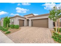 Charming home featuring a spacious three-car garage and neatly landscaped front yard at 2654 Summit Springs St, Henderson, NV 89044