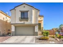 Inviting two-story home with a well-maintained front yard, garage, and charming architectural details at 3592 Gloucester Gate St, Las Vegas, NV 89122