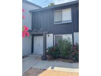 Charming two-story home with a covered entrance and tidy landscaping at 4016 Edgeford Pl, Las Vegas, NV 89102