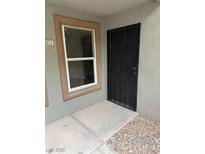 Home entrance featuring a black security door and neutral toned walls at 555 E Silverado Ranch Blvd # 1034, Las Vegas, NV 89183