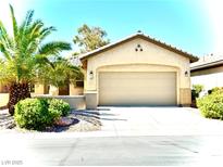 Charming single-story home with a well-manicured lawn and a spacious two-car garage at 6001 Falconer Ave, Las Vegas, NV 89122