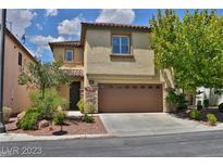 Charming two-story stucco home with a two-car garage and desert landscaping at 7733 Donner Peak St, Las Vegas, NV 89166